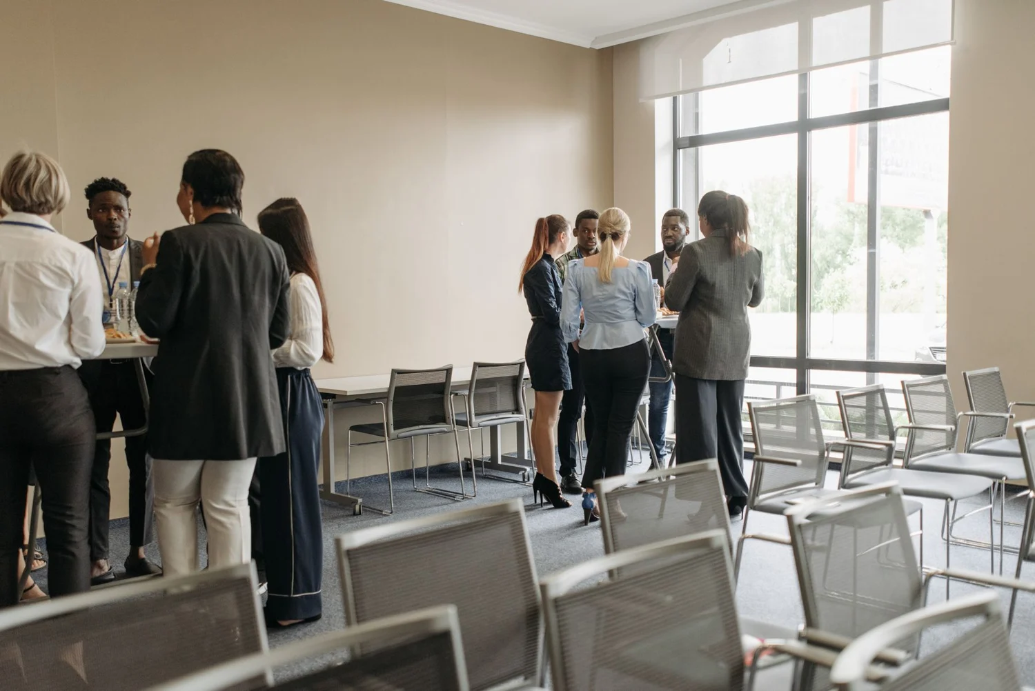 Attendees talking during a break between conference sessions